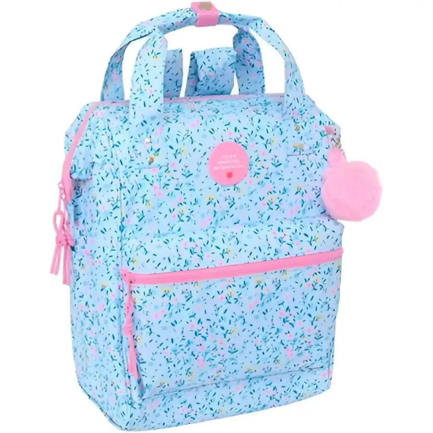 Mochila azul claro con patrón floral, cremalleras y pompon rosas de Vicky Martín Berrocal