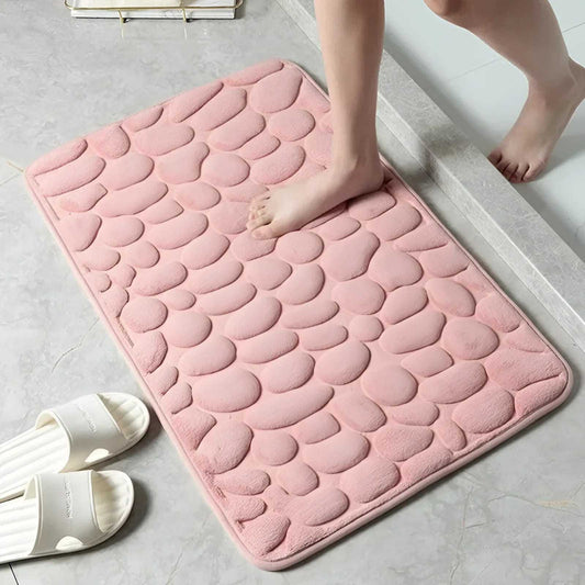 alfombra de baño antideslizante rosa con diseño de adoquines esponjosos